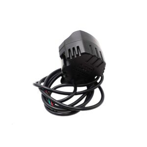 Black compact electronic module with a long, coiled cable attached, featuring vented housing and molded ridges.
